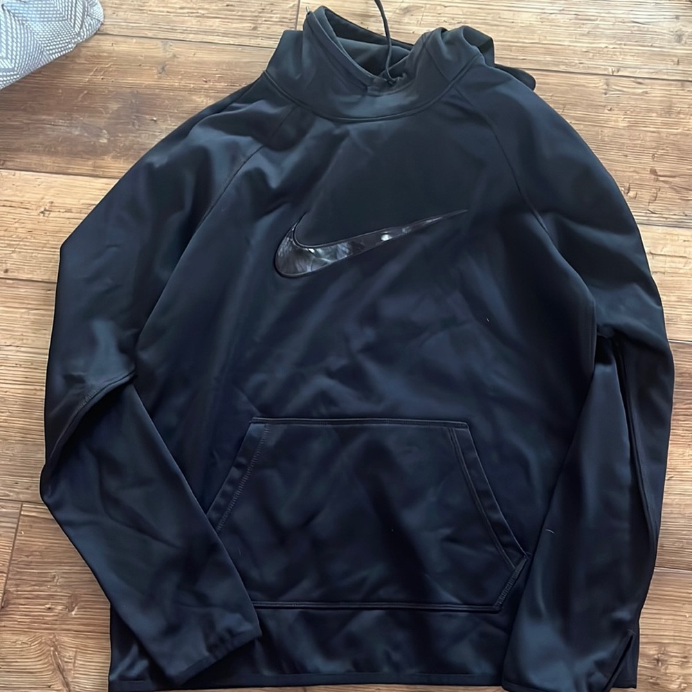 Black Nike sweatshirt. Fleece inside with higher neck